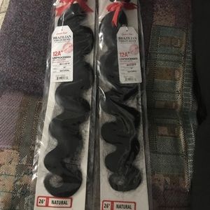 26 inches of virgin human hair. Dyes and bleaches great. Body wave